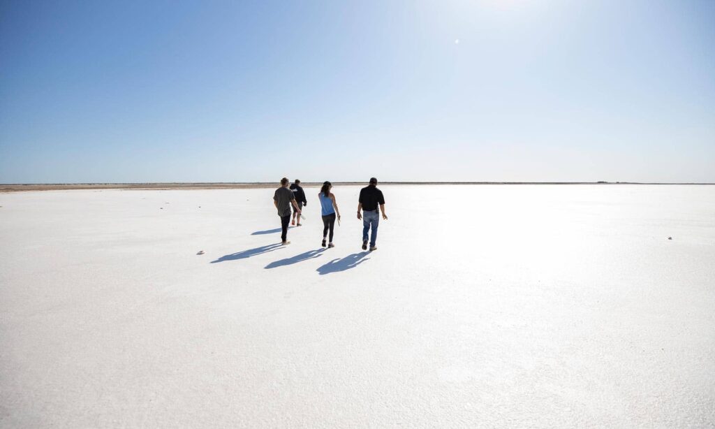 Guests hiking/ exploring  Baja's salt flats during the best season: November to April